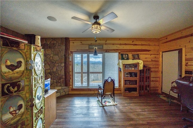 office space featuring a textured ceiling, ceiling fan, and dark wood-type flooring