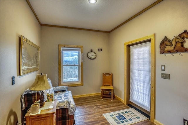 interior space with hardwood / wood-style flooring and crown molding