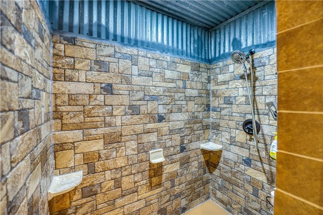 bathroom with tiled shower