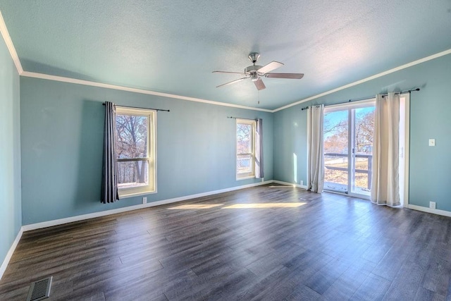 empty room featuring a textured ceiling, ceiling fan, ornamental molding, and dark wood-type flooring