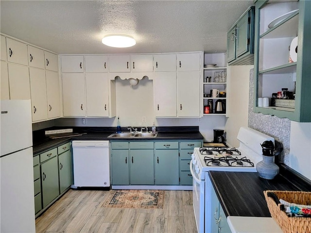 kitchen with white cabinetry, sink, light hardwood / wood-style flooring, a textured ceiling, and white appliances