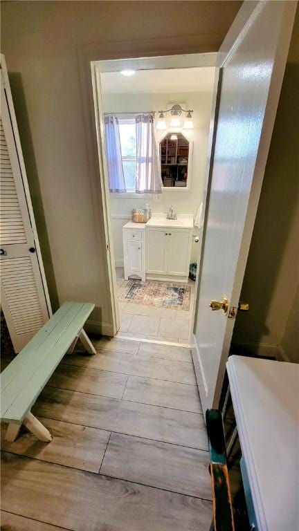 bathroom featuring hardwood / wood-style floors and vanity