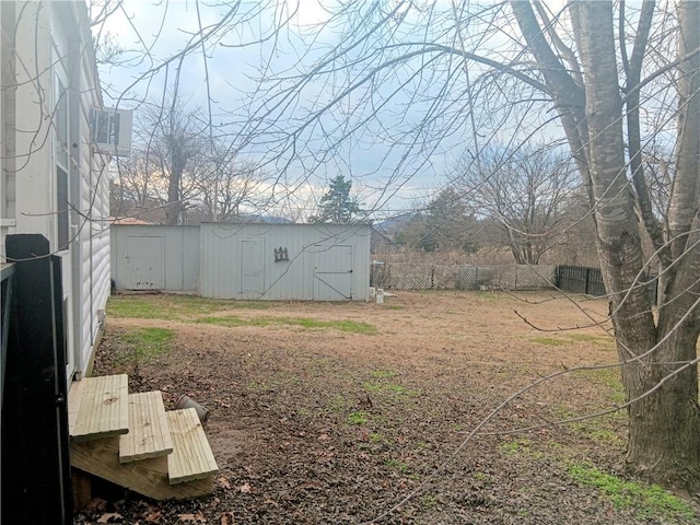 view of yard with a storage unit