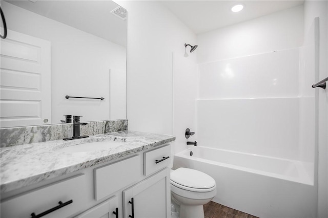 full bathroom with shower / bathtub combination, vanity, toilet, and wood-type flooring