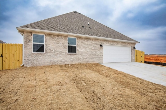 view of side of property with a garage