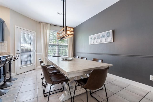 1515/1517 Belle Royal Ct, Bentonville, AR 72712 - dining area featuring light tile patterned floors and baseboards