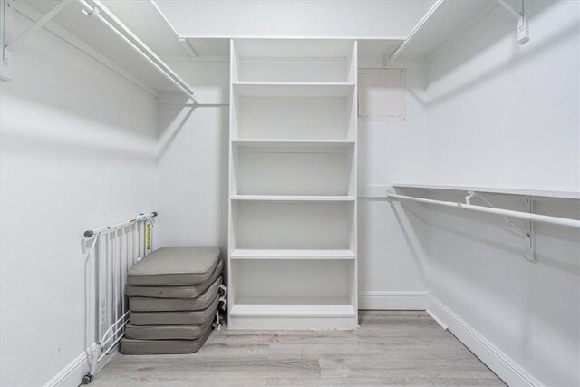 1515/1517 Belle Royal Ct, Bentonville, AR 72712 - spacious closet featuring wood finished floors