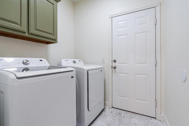 1515/1517 Belle Royal Ct, Bentonville, AR 72712 - washroom featuring cabinet space, light marble finish flooring, washing machine and dryer, and baseboards
