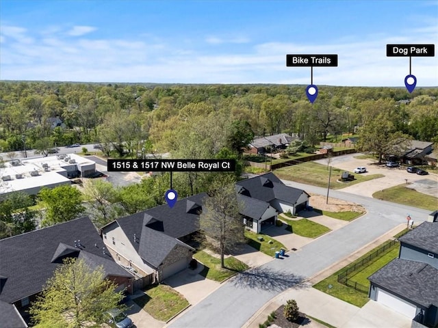1515/1517 Belle Royal Ct, Bentonville, AR 72712 - aerial view of residential area with a heavily wooded area