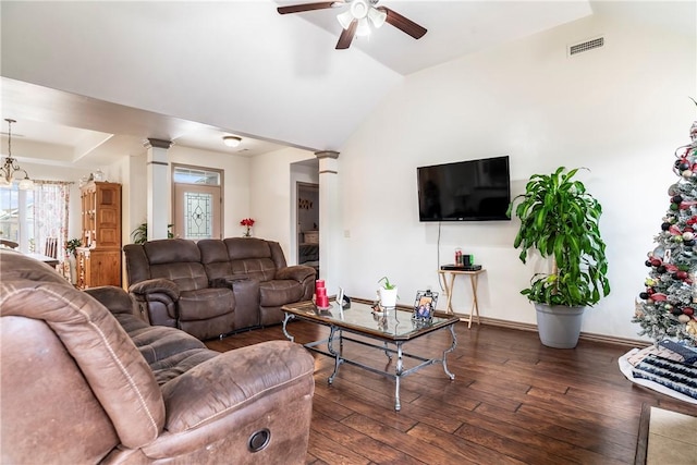 living room with ceiling fan, dark hardwood / wood-style floors, and ornate columns