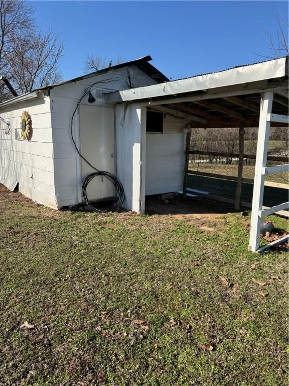 view of outdoor structure with a carport