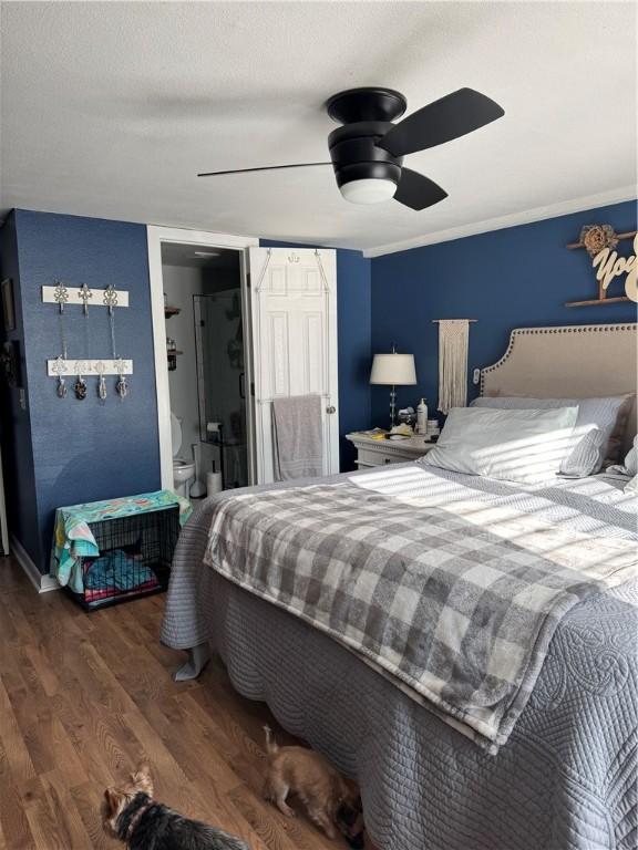 bedroom with ornamental molding, wood finished floors, and ceiling fan