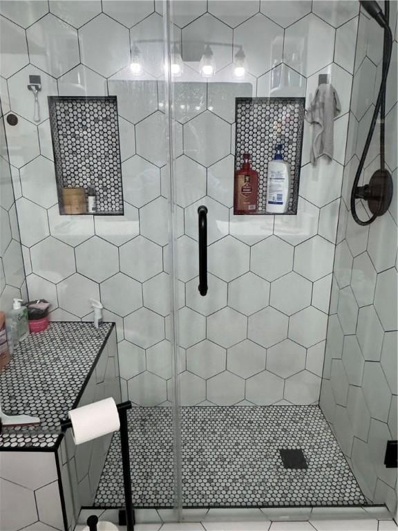 full bath featuring a tile shower