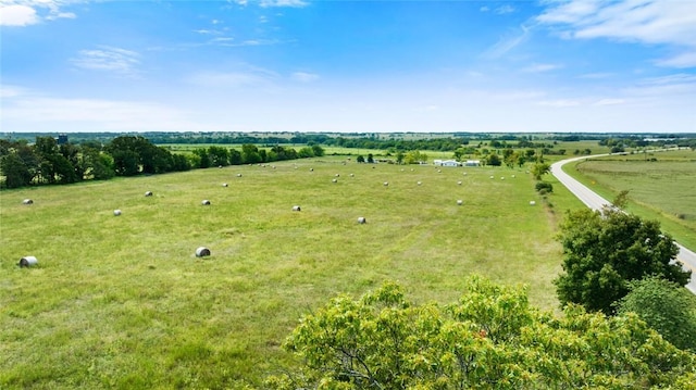 birds eye view of property featuring a rural view