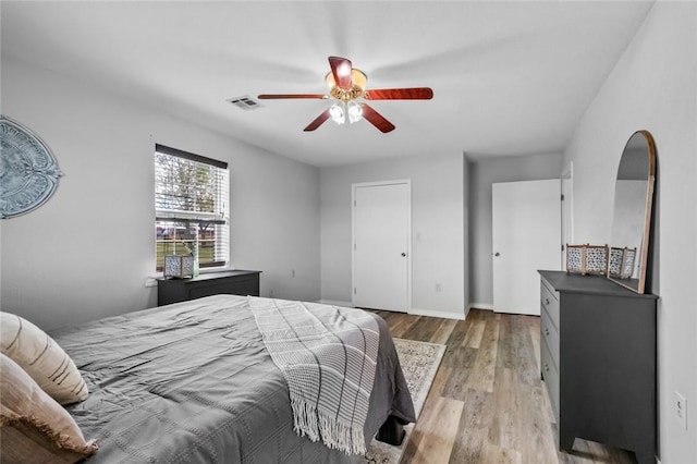 bedroom featuring ceiling fan and light wood-type flooring