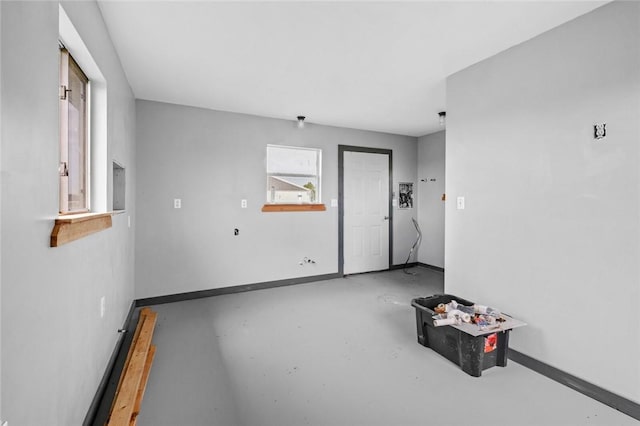 spare room with concrete floors