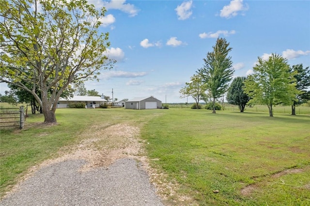 view of yard featuring an outbuilding and a garage