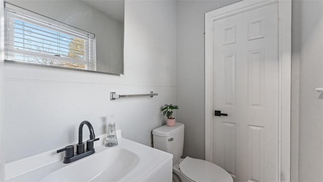 bathroom with sink and toilet