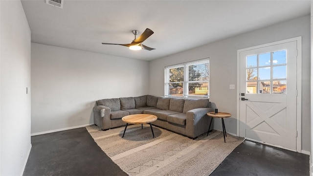 living room featuring concrete flooring and ceiling fan