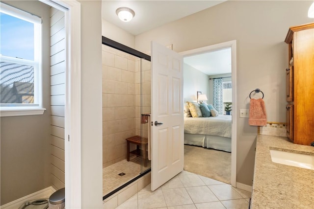 bathroom featuring vanity, tile patterned floors, and an enclosed shower