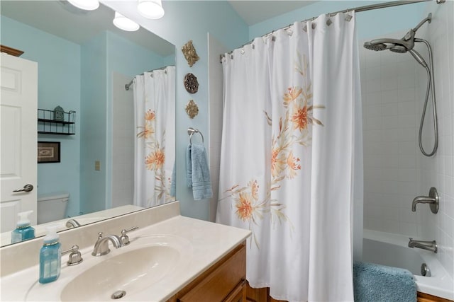 full bathroom with vanity, toilet, and shower / bath combo with shower curtain