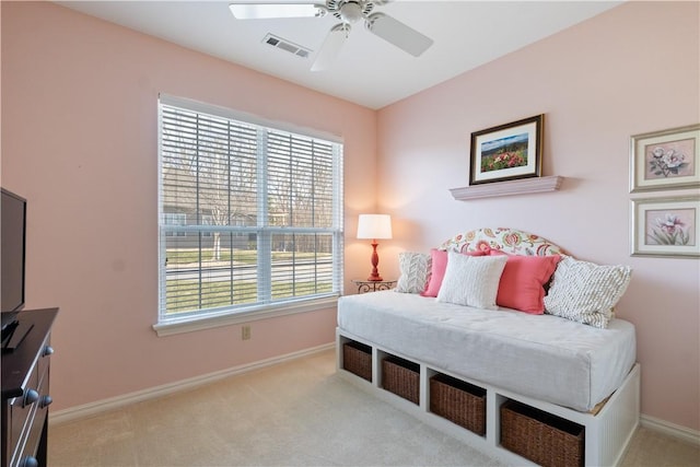 bedroom with light colored carpet and ceiling fan