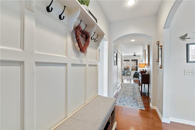 mudroom with ceiling fan and wood-type flooring