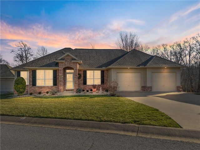 ranch-style home with a lawn and a garage