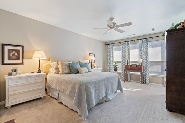 bedroom featuring ceiling fan and light colored carpet