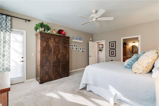 carpeted bedroom featuring ensuite bath and ceiling fan