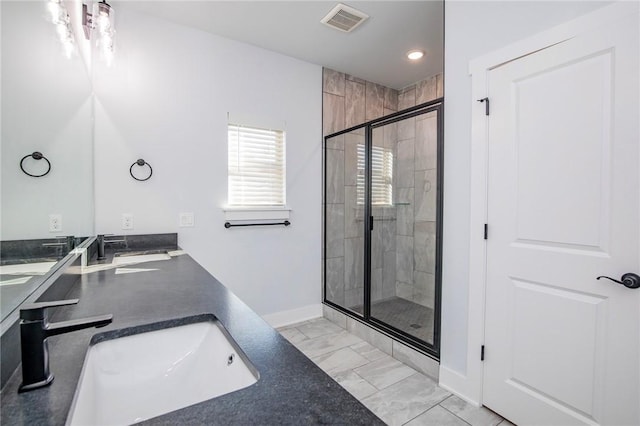 bathroom featuring double vanity, a stall shower, visible vents, marble finish floor, and a sink