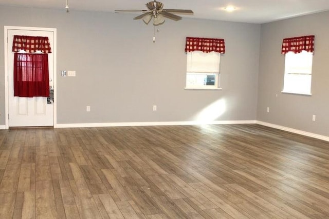 spare room featuring ceiling fan and wood-type flooring