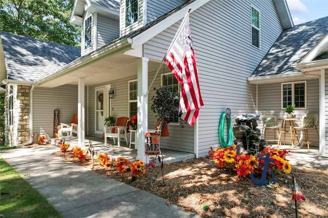 view of exterior entry featuring a porch