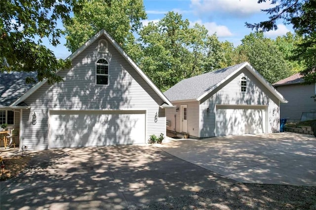 view of front of home featuring an outbuilding and a garage