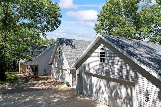 view of side of property with a garage