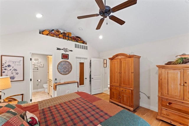 bedroom with vaulted ceiling, light hardwood / wood-style flooring, ensuite bath, and ceiling fan