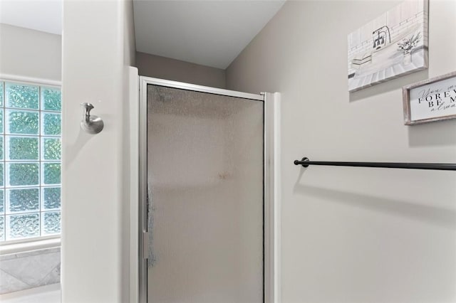 bathroom featuring plenty of natural light and an enclosed shower