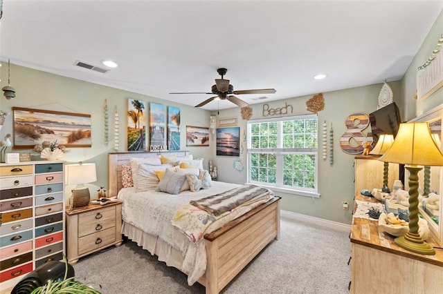 bedroom featuring light carpet and ceiling fan