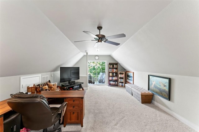 office featuring light carpet, ceiling fan, and vaulted ceiling