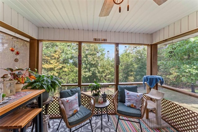 sunroom / solarium featuring ceiling fan