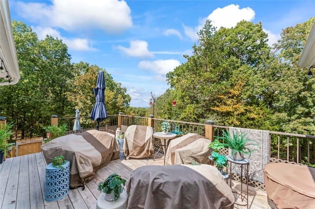 wooden terrace featuring grilling area