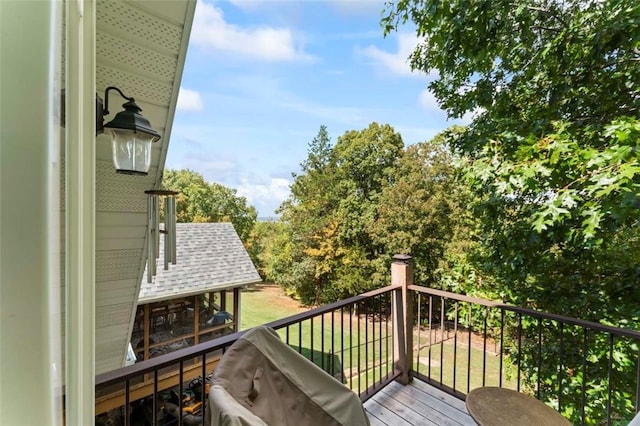 wooden deck with a grill