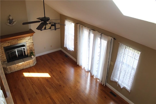 635 Ranchview Rd, Ridgedale, MO 65739 - unfurnished living room featuring wood finished floors, ceiling fan, lofted ceiling, and a fireplace