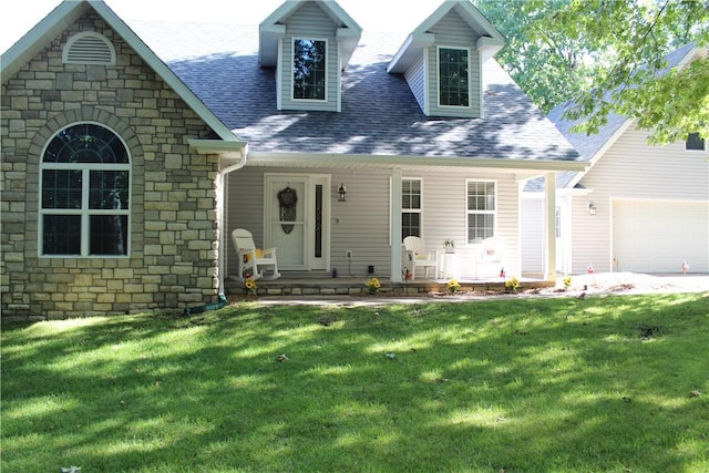 635 Ranchview Rd, Ridgedale, MO 65739 - view of front of property featuring stone siding, roof with shingles, a front yard, covered porch, and an attached garage