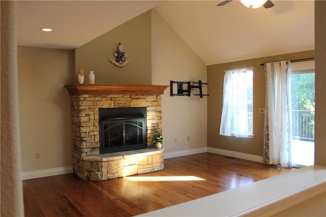 635 Ranchview Rd, Ridgedale, MO 65739 - unfurnished living room with wood finished floors, a ceiling fan, a stone fireplace, lofted ceiling, and recessed lighting