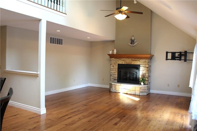 635 Ranchview Rd, Ridgedale, MO 65739 - unfurnished living room featuring high vaulted ceiling, a ceiling fan, wood finished floors, and a fireplace
