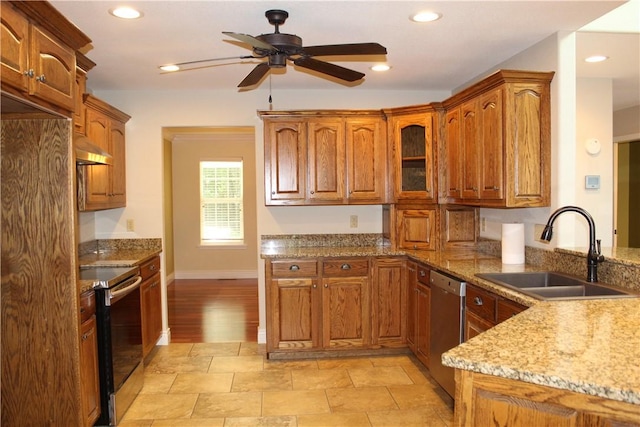 635 Ranchview Rd, Ridgedale, MO 65739 - kitchen with appliances with stainless steel finishes, under cabinet range hood, light stone countertops, ceiling fan, and brown cabinets