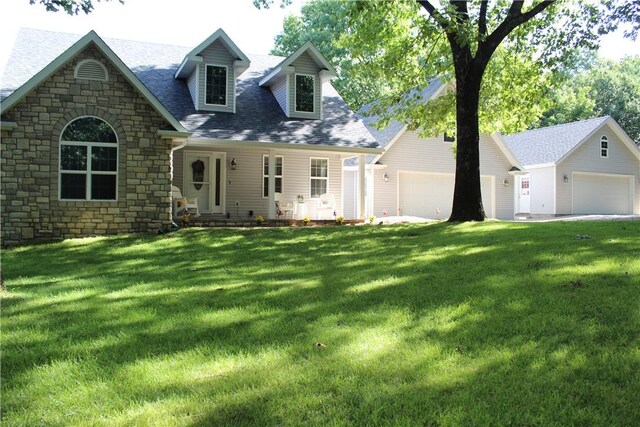 635 Ranchview Rd, Ridgedale, MO 65739 - view of front of property with stone siding, a front lawn, roof with shingles, and an outbuilding