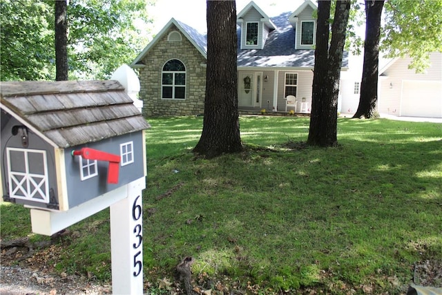 635 Ranchview Rd, Ridgedale, MO 65739 - view of front of property with a front yard, a garage, stone siding, and an outdoor structure
