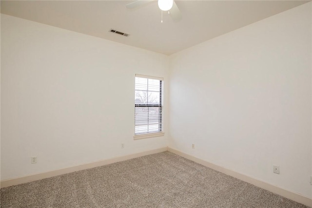 unfurnished room with ceiling fan and carpet floors